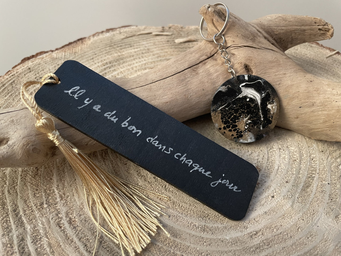 Black and gold wooden bookmark and keychain set with inscription on the back of the bookmark