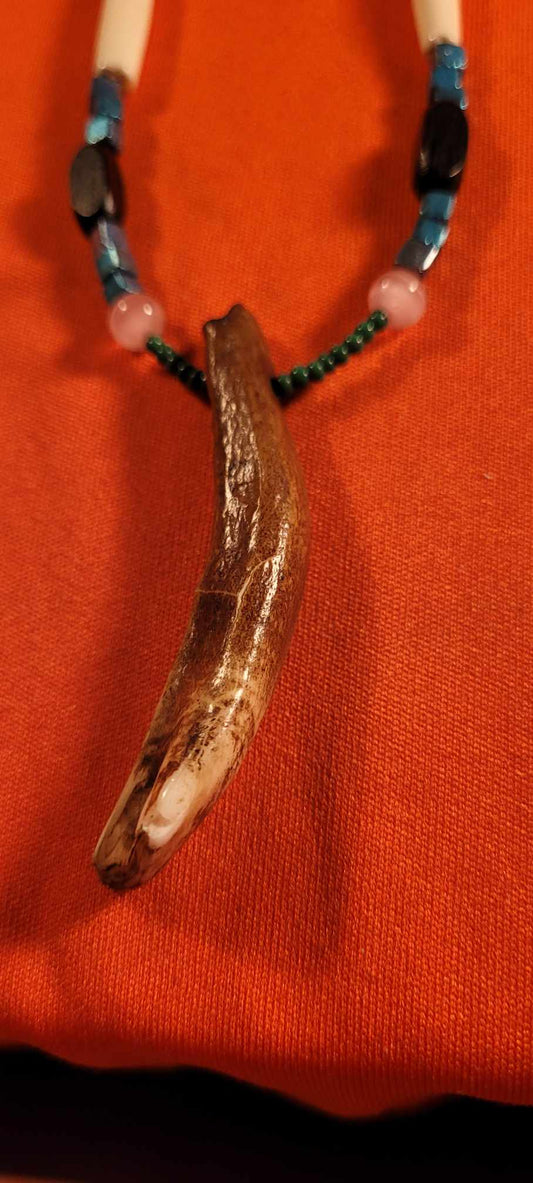 Necklace made of real toar tooth.