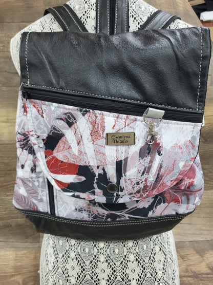 Backpack with red foliage flap and black genuine leather