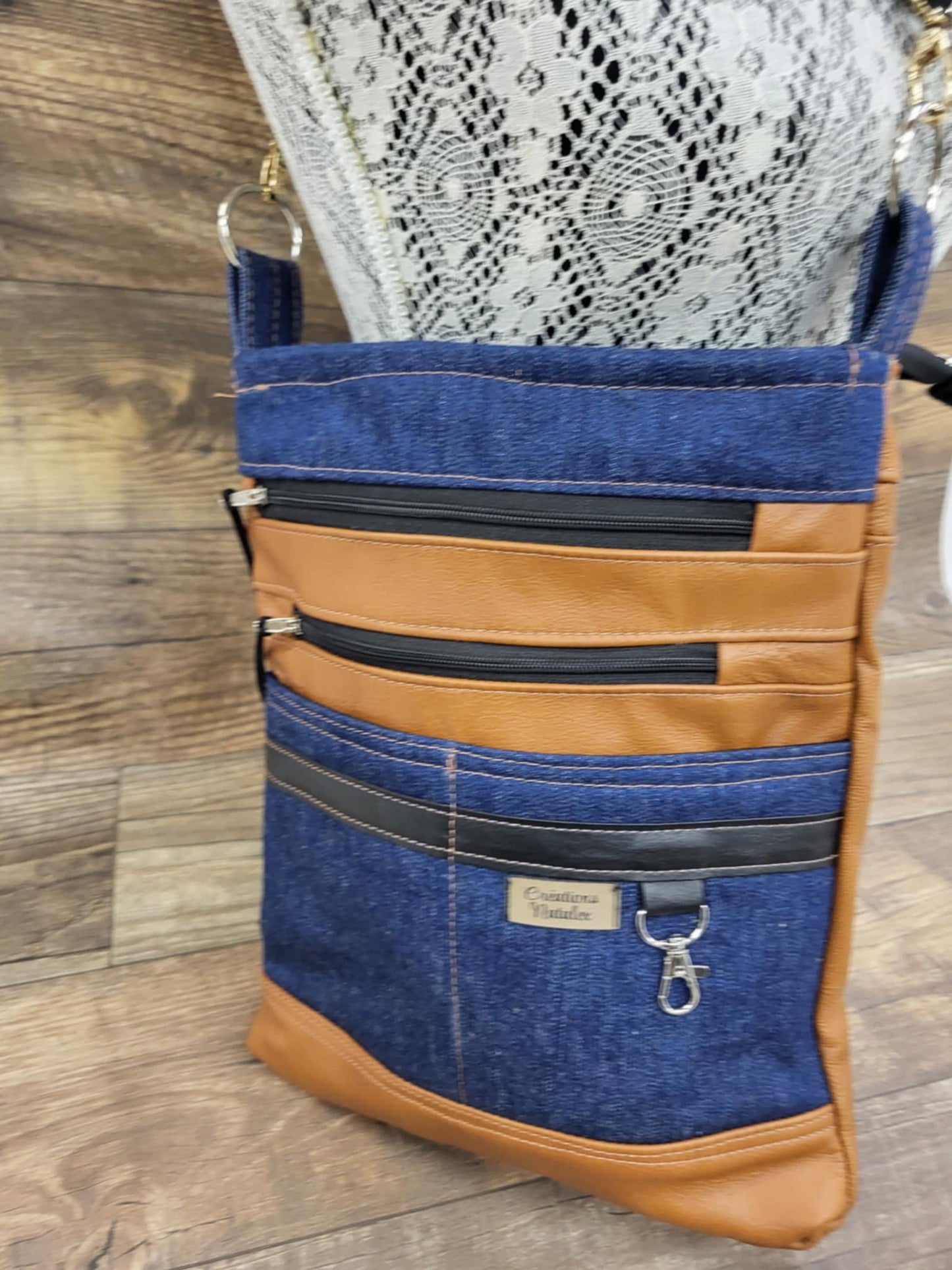 Multi-pocket handbag in jeans and genuine leather tan color