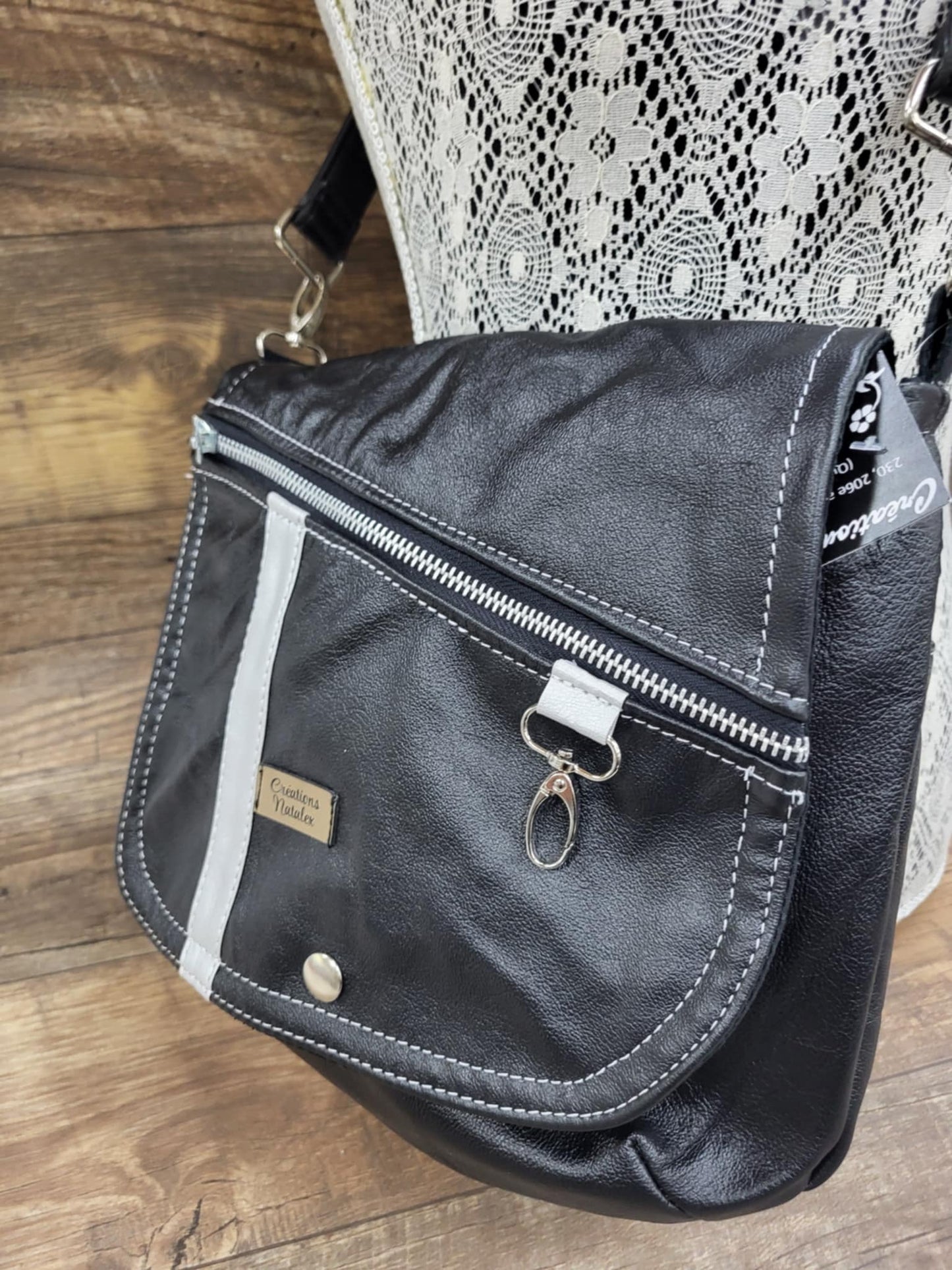 Black leather handbag with flap