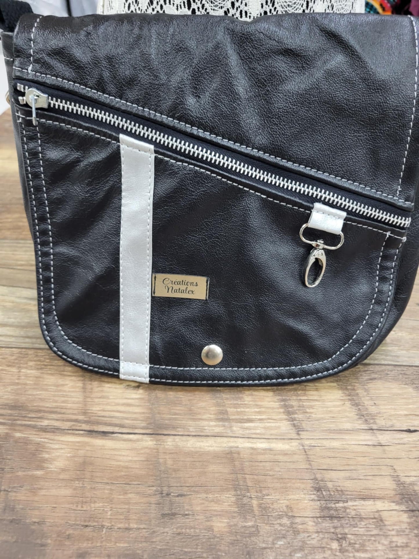 Black leather handbag with flap