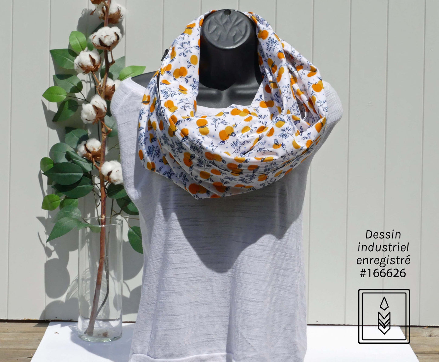 White scarf with orange motifs