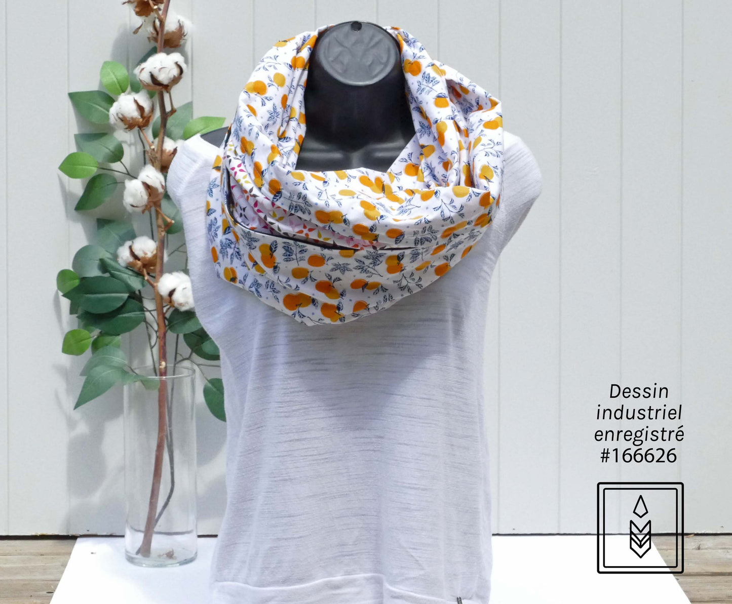 White scarf with orange motifs