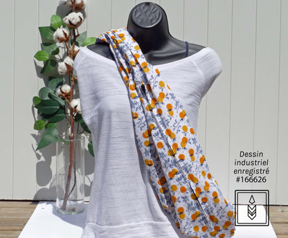 White scarf with orange motifs