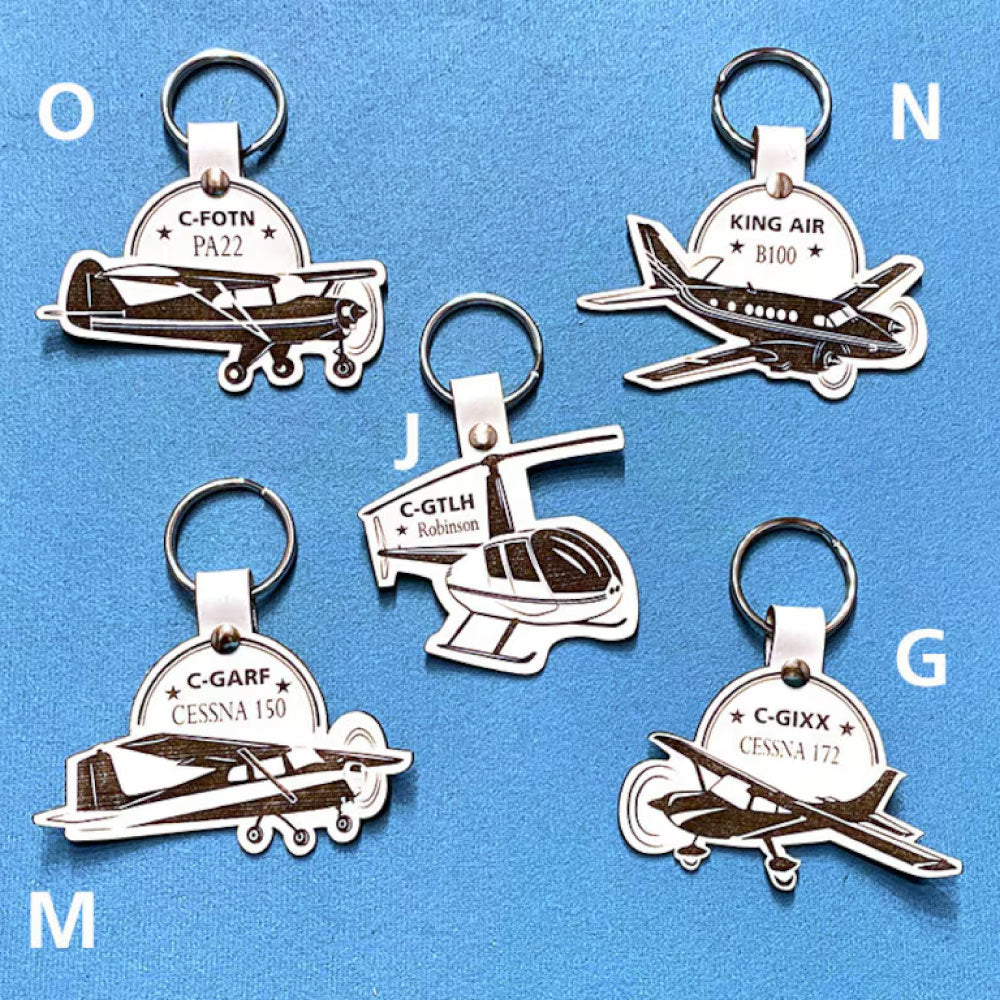 2 Personalized leather keyrings with identification letter and plane model. 2 Keychains personalized with plane tail number