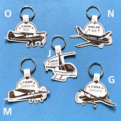 2 Personalized leather keyrings with identification letter and plane model. 2 Keychains personalized with plane tail number